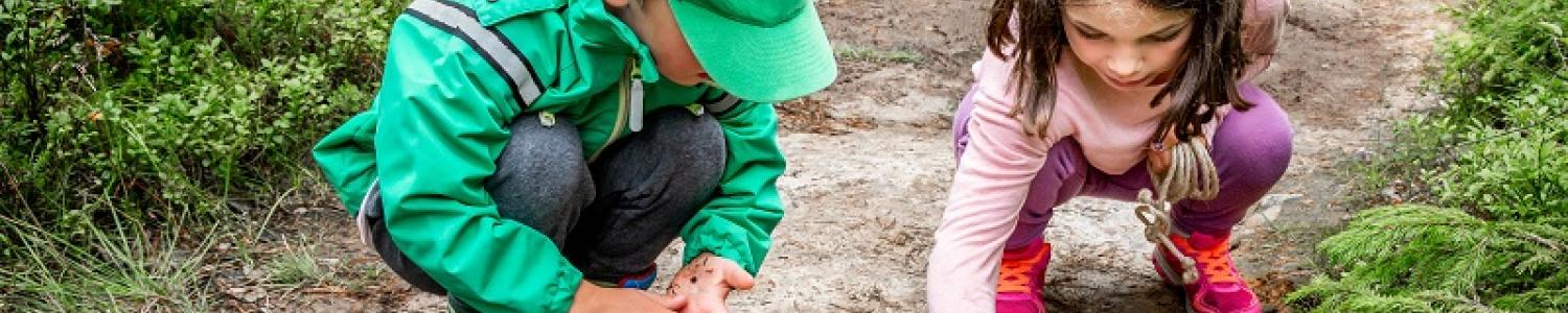 Young children playing in nature