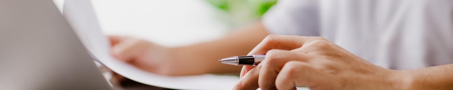 Director conducting calculations on a laptop
