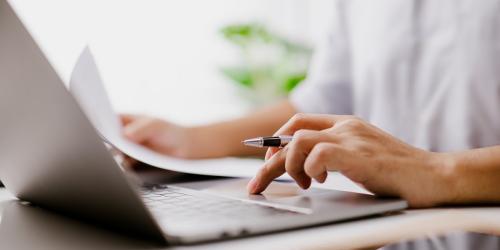 Director conducting calculations on a laptop
