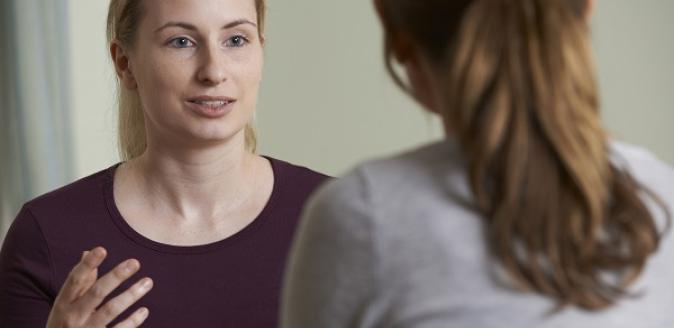 Two educators having a conversation together